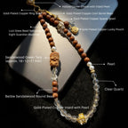 Sandalwood Buddha Charm Phone Strap with labeled components on a reflective surface