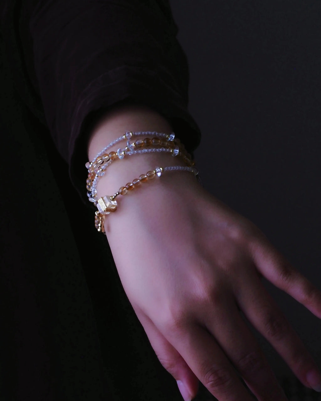 Citrine pyramid crystal bracelet paired with a clear quartz bracelet for layering.