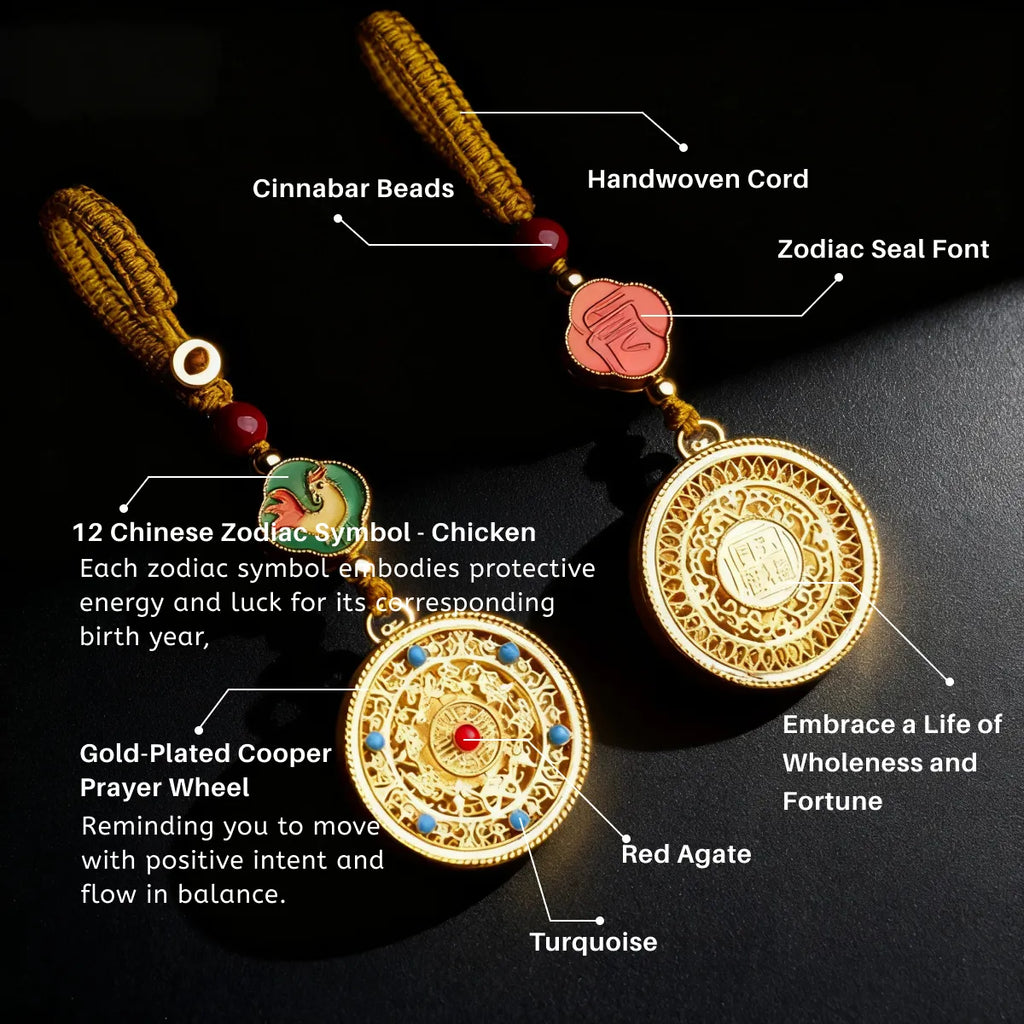 Gold pendant with zodiac symbol, prayer wheel, and colored stones on a black background
