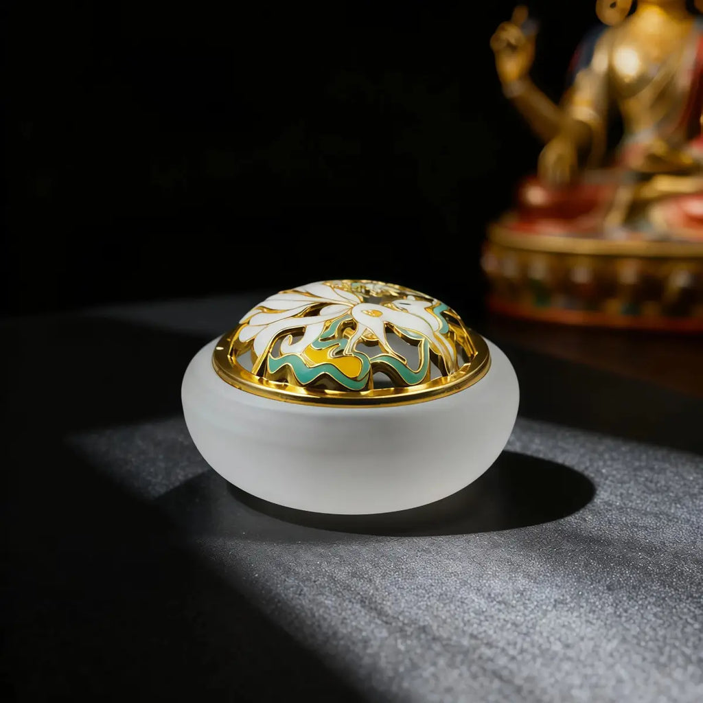 Frosted_White Decorative incense holder with floral design on a dark background, with a tibetan style buddha