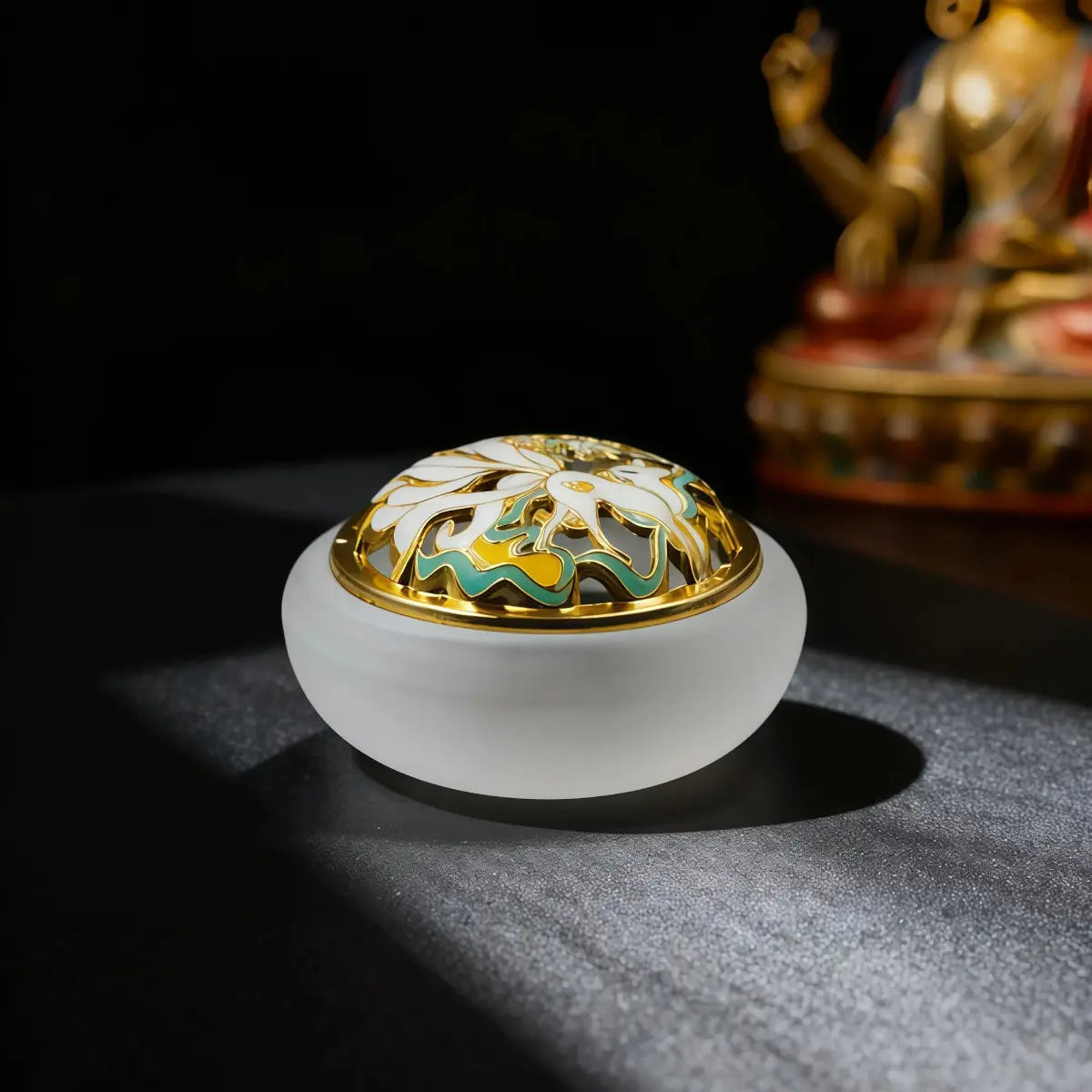 Frosted_White Decorative incense holder with floral design on a dark background, with a tibetan style buddha